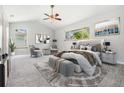 Main bedroom with staged furniture and carpet at 6536 Northlake Dr, Zephyrhills, FL 33542