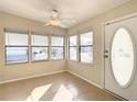 Bright sunroom with tiled floors and multiple windows at 34051 Brown Byu, Wesley Chapel, FL 33543