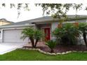 House exterior with landscaping at 20006 Nob Oak Ave, Tampa, FL 33647