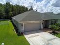 House exterior with attached garage at 20006 Nob Oak Ave, Tampa, FL 33647