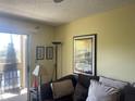 Living room with sofa and access to balcony at 115 112Th Ne Ave # 605, St Petersburg, FL 33716