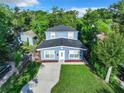 Expansive aerial view of this beautiful two-story home, nestled in a lush green landscape at 3128 17Th N St, St Petersburg, FL 33713