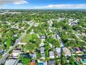 Wide aerial shot of a neighborhood showcasing the density of homes among mature trees at 3128 17Th N St, St Petersburg, FL 33713