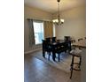 Spacious dining room with a large table and bench seating at 3464 Silverstone Ct, Plant City, FL 33566