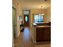 Bright kitchen with an island and access to dining area at 3464 Silverstone Ct, Plant City, FL 33566