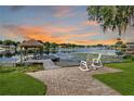 Backyard patio featuring a dock and serene water view at 3744 E Lake Dr, Land O Lakes, FL 34639