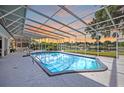 Enjoy the screened in pool with a gorgeous water view at 3744 E Lake Dr, Land O Lakes, FL 34639