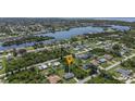 Aerial view showcasing the home's location near a canal and other houses at 455 Lenoir Nw St, Port Charlotte, FL 33948