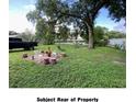 Large backyard with fire pit and plenty of open space at 4605 N 39Th St # 1/2, Tampa, FL 33610