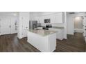 Modern kitchen with island, stainless steel appliances and granite countertops at 29508 Fedora Cir, Brooksville, FL 34602