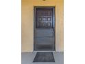 Condo front door with screen door and welcome mat at 8699 Bardmoor Blvd # 304, Seminole, FL 33777