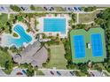 Community pool, area, lap lanes, tennis courts, and ample parking at 7134 Heather Sound Loop, Wesley Chapel, FL 33545