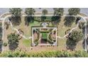 Well maintained community park with walking paths, benches, and lush landscaping seen from above at 7134 Heather Sound Loop, Wesley Chapel, FL 33545