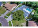 Aerial view showing house, pool, and surrounding neighborhood at 4008 Greenmark Ln, Valrico, FL 33596