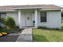 Front view of a ranch-style home with columns at 10223 Us Highway 301, Dade City, FL 33525