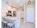 Modern kitchen with stainless steel appliances and an island at 9107 Carolina Wren Dr, Tampa, FL 33626