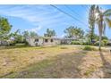 Single-story home with a well-manicured lawn at 10735 64Th N Ave, Seminole, FL 33772