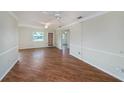 Spacious living room featuring beautiful hardwood floors and bright natural light at 10735 64Th N Ave, Seminole, FL 33772