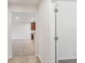 Interior hallway view leading to a kitchen and additional rooms at 17770 Turning Leaf Cir, Land O Lakes, FL 34638