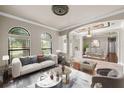 Spacious living room features a neutral color palette and access to the dining area at 331 Star Shell Dr, Apollo Beach, FL 33572