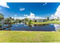 Tranquil canal-front property with lush landscaping and a spacious yard at 29171 Orva Dr, Punta Gorda, FL 33982
