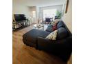 Spacious living room featuring a comfortable sectional sofa and stylish decor at 10200 Gandy Blvd # 1116, St Petersburg, FL 33702