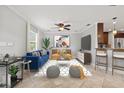 Bright living room with blue sofa and open kitchen at 2707 W Leroy St, Tampa, FL 33607