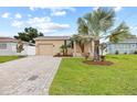 Home exterior, landscaped lawn, paved driveway at 2707 W Leroy St, Tampa, FL 33607