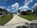 House with a long driveway and a spacious front yard at 2702 Campus Hill Dr, Tampa, FL 33612