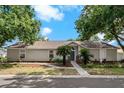 Single story home with a landscaped yard at 1424 Walden Oaks Pl, Plant City, FL 33563