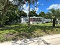 Single-Gathering home with covered porch and fenced yard at 36825 Eden St, Zephyrhills, FL 33541