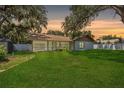 Spacious backyard with a large grassy area at 2925 Starmount Dr, Valrico, FL 33596