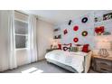 Bedroom with a daybed, white brick feature wall, and record albums at 18014 Tavernside Trl, Lakewood Ranch, FL 34211