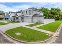 Two story home on corner lot with large driveway and fenced yard at 6816 S Sparkman St, Tampa, FL 33616