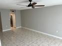 Bright living room with tile floors and ceiling fan at 811 Russell Ln # 309, Brandon, FL 33510