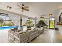 Relaxing covered patio overlooking a refreshing pool at 5709 E Longboat Blvd, Tampa, FL 33615