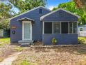 Quaint blue house with a screened porch at 1751 28Th S St, St Petersburg, FL 33712