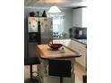 Kitchen with island and stainless steel appliances at 2905 W Cherry St, Tampa, FL 33607