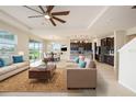 Open concept living area with stylish furniture and tile floors at 16632 Goose Ribbon Pl, Wimauma, FL 33598
