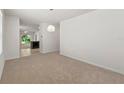 Spacious dining area with neutral walls and carpet flooring at 10920 Carlton Fields Dr, Riverview, FL 33579