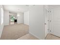 Bright and airy living room with carpet flooring and neutral walls at 10920 Carlton Fields Dr, Riverview, FL 33579