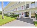 Building exterior with walkway and elevator access at 5728 14Th N Ave # 104B, St Petersburg, FL 33710