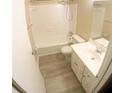 Clean bathroom with a tub, shower, and updated vanity at 4335 Aegean Dr # 106A, Tampa, FL 33611