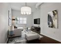 Bright living room features a comfy sofa and large TV, perfect for relaxing at 520 S Armenia Ave # 1232, Tampa, FL 33609