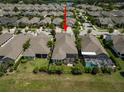 Aerial view of house with pool and neighborhood at 13939 Swallow Hill Dr, Lithia, FL 33547