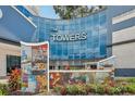 The Towers condo building entrance with mosaic art and signage at 1209 E Cumberland Ave # 807, Tampa, FL 33602