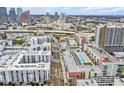 Drone shot showing modern apartment complex near city skyline at 1208 E Kennedy Blvd # 734, Tampa, FL 33602