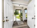 Front entry with double doors opening to a screened porch at 684 Corrientes Cir, Punta Gorda, FL 33983