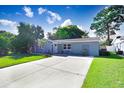 Cute ranch home with a well-manicured lawn at 6154 Delaware Ave, New Port Richey, FL 34653