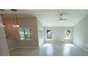 Bright living room with tile floors, vaulted ceiling and sliding glass doors at 3422 29Th E St, Bradenton, FL 34208